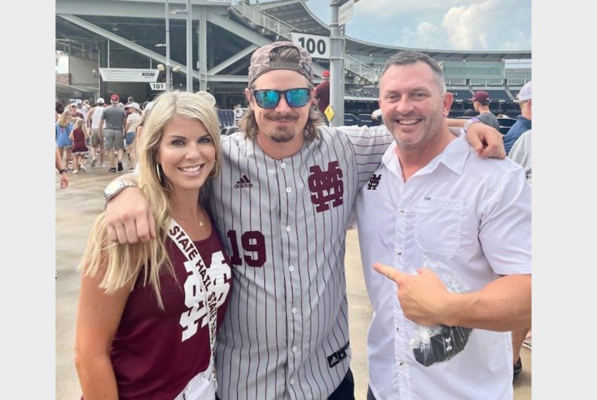 Brooks Bryan, right, formerly of Philadelphia, and his wife Beth are pictured with Michael Hardy, known to country music fans as Hardy, another former Neshoba County resident, at the College World Series in Omaha Nebraska.